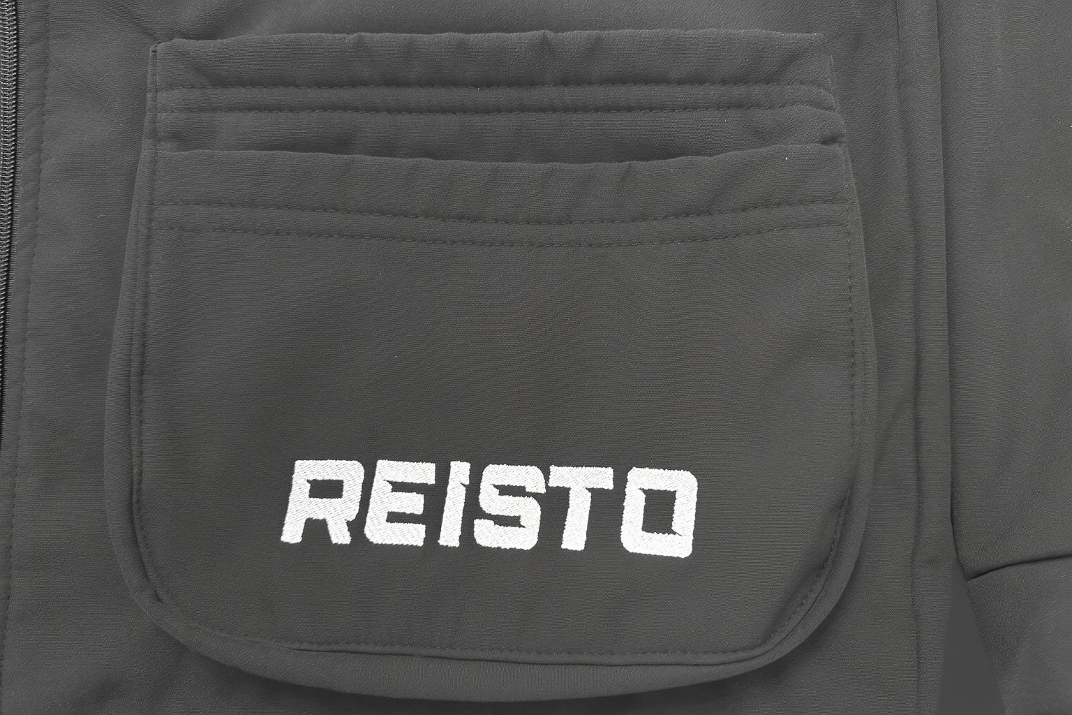 Close-up of angled pocket on REISTO Softshell Shooting Jacket – easy-access design for cartridges and essentials